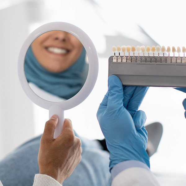 person looking at veneer samples